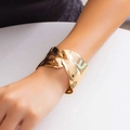 Close-up of golden irregular wavy cuff bracelet with polished finish on female wrist - Irregular Wave Wide Style (Gold)