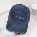 Close-up of white embroidered the future text on washed navy blue baseball cap - Navy Blue
