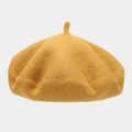 Detail of a mustard yellow wool beret featuring a soft texture and classic top stem detail - One Size / Yellow