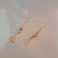 Detail of 18K gold stainless steel earrings with pink agate beads and sun charms - Sun Shape with Pink Stone (101 Sun)