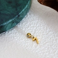 Polished gold number 7 pendant on a white surface with minimalist decor - Number Pendant (7) / Gold