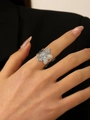 Silver flower ring with textured petals worn on finger, minimalist floral jewelry piece - Silver Flower Ring (WG-0814)