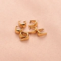 Set of six golden stainless steel pinch bails for DIY jewelry making on pink fabric - Gold