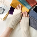 Knitted fingerless gloves in cream white with colorful variety displayed in background - One Size / Beige