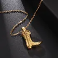 Macro shot of gold cowboy boot pendant showing detailed stitching and polished finish - Boots Charm / Gold