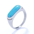 Macro view of a silver ring featuring a rectangular turquoise inlay and polished finish - Blue Natural Stone + Steel Color