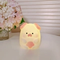 Cute pig cartoon night light emitting warm yellow glow made of soft silicone material - Dun Dun Pig