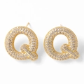Golden stud earrings featuring letter Q shape with sparkling pavé cubic zirconia - Letter Q