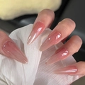 Detailed view of long almond press-on nails with nude pink gradient glossy finish - By1594 Pink Aurora / Glue Type