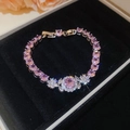 Macro view of pink zircon flower bracelet on black velvet with elegant flower decor - Bracelet-Pink Flower