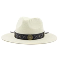 Detail of bohemian straw hat crown featuring black band with metal discs and gray stitching - Creamy White