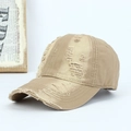 Close-up of distressed khaki cotton baseball cap showing vintage frayed edges and holes - Adjustable / Khaki