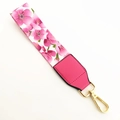 Close-up of pink floral bag strap with gold metal clasp and faux leather reinforcement - Pink Flowers + Rose Pink Leather