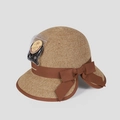 Detail of elegant straw sun hat with large bow and fine natural plant fiber weaving - M (56-58cm) / Caramel color