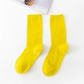 Vibrant yellow ribbed cotton crew socks for women in a minimalist flat lay display - Medium Yellow (Dull)