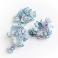 Detailed view of three blue and pink gradient faux hydrangea flowers for DIY crafts - Peacock Blue