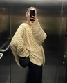 Oversized beige cable knit turtleneck sweater styled with black skirt in a modern elevator - S / Beige