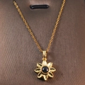 Golden sunflower necklace featuring a black onyx-style stone and delicate O-chain link - Gold - Sunflower Black Onyx Effect