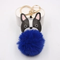Macro detail of bulldog plush keychain featuring a golden metal clip and deep blue faux fur - Sapphire Blue