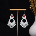 Detail of silver bohemian earrings with red stones on a golden display stand - Silver Red Retro Hollow(E7270)