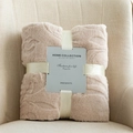 Folded champagne flannel throw blanket with floral texture and gift ribbon packaging - Khaki