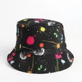 Close-up of black bucket hat with colorful spray paint graffiti and stitching details - M (56-58cm) / Black Paint Splatter