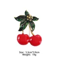 Detail view of red cherry brooch with size measurements 5.3cm by 3.9cm and 19g weight - Red Green Enamel Cherry-XD824263