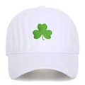 White cotton baseball cap featuring green shamrock clover embroidery on the front panel - White