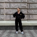 Tuta sportiva nera da donna in due pezzi con cappuccio, ricamo leone e vestibilità rilassata - S / Nero