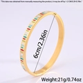 Detail view of titanium steel bangle showing 6cm diameter size and colorful enamel dots - Gold Irregular Enamel