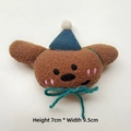 Detail of plush brown bear accessory with blue hat and bow, dimensions H 7cm x W 9.5cm - Brooch Style / Green Hat Coffee Dog