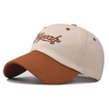 Detail of color-block cotton baseball cap showing brown 3D embroidery on cream fabric - Adjustable / Beige Patchwork Caramel