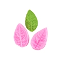 Macro view of pink leaf-shaped silicone fondant molds with realistic leaf texture detail - Style 9 - Pink