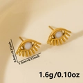 Detailsicht der goldenen Augen-Ohrringe mit Maßen 0.8x1.3cm und 1.6g Gewichtsangaben - Gold-Weiß Zentrum (Paar)