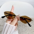 Retro rhombus sunglasses featuring a gold metal frame and brown lenses shown in hand - Gold Frame Brown Lens