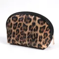Polished leopard print makeup bag featuring a crescent shape and golden zipper puller - Leopard Shell Bag