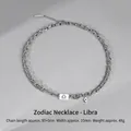Silver Libra zodiac necklace with dual Cuban chain and blue stone pendant - Libra