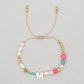 Adjustable hand-woven beaded bracelet with freshwater pearls and a white letter M charm - Letter M Style (ZZ-B24061901M-F)