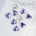 Macro detail of lavender and silver heart-shaped K9 crystals with multifaceted cut - Crooked Heart 12x13mm