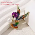 Colorful hummingbird brooch with purple enamel and white pearl accents on golden base - Hummingbird Style (YNCP5801)