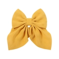 Close-up of bright yellow floral bow hair clip featuring delicate eyelet embroidery texture - Yellow