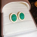 Detail of vintage oval earrings with green faux gems and white enamel in a jewelry box - Green Oval (25#)