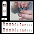 Detail of almond-shaped French press-on nails with black tips and gold glitter stars - Black Gold Powder (W433)