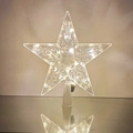 Close-up of a clear star tree topper with warm white LED lights and ornate swirl patterns - 21x23cm Hollow Flower Warm White (Button Battery)