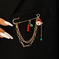 Punk style gold safety pin brooch featuring Santa Claus pendant and red beads on black suit - Christmas Red Green Beads Style (11560)