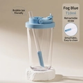 Detail view of 710ml clear Tritan tumbler with blue lid and retractable straw design - 24oz / Haze Blue