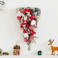 Christmas teardrop wreath with flocked cedar branches, red bows, and festive ornaments - Snow-flocked Teardrop Swag