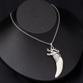 Detail of silver dragon head necklace featuring a curved faux wolf tooth on a black bust - Dragon Head with White Tooth Style 2