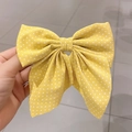 Yellow hair clip with white polka dots featuring a large fabric bow design for women - Polka Dot / Yellow