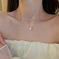 French style layered double chain necklace with irregular pearl pendant on female model - Silver Bean
